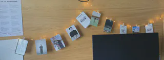 fairy lights with clipped on cards, each card with a diffferent picture or message
